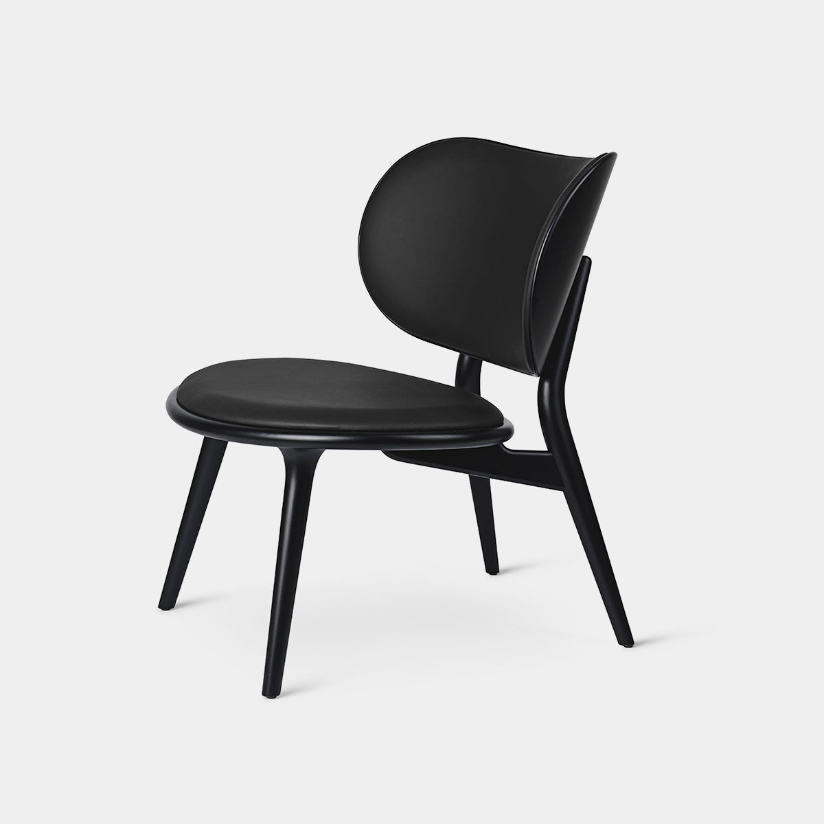 Mater Lounge Chair in black, featuring a curved and contoured design for comfort and style in any space.