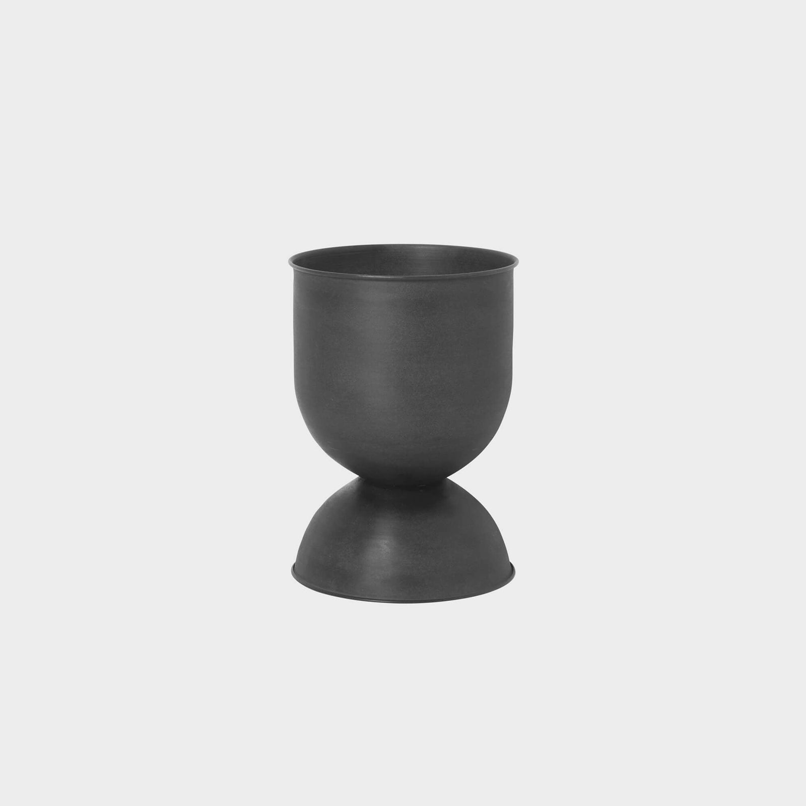 Hourglass Planter made of matte-finished metal, designed for versatile use while adding a modern touch to any space.