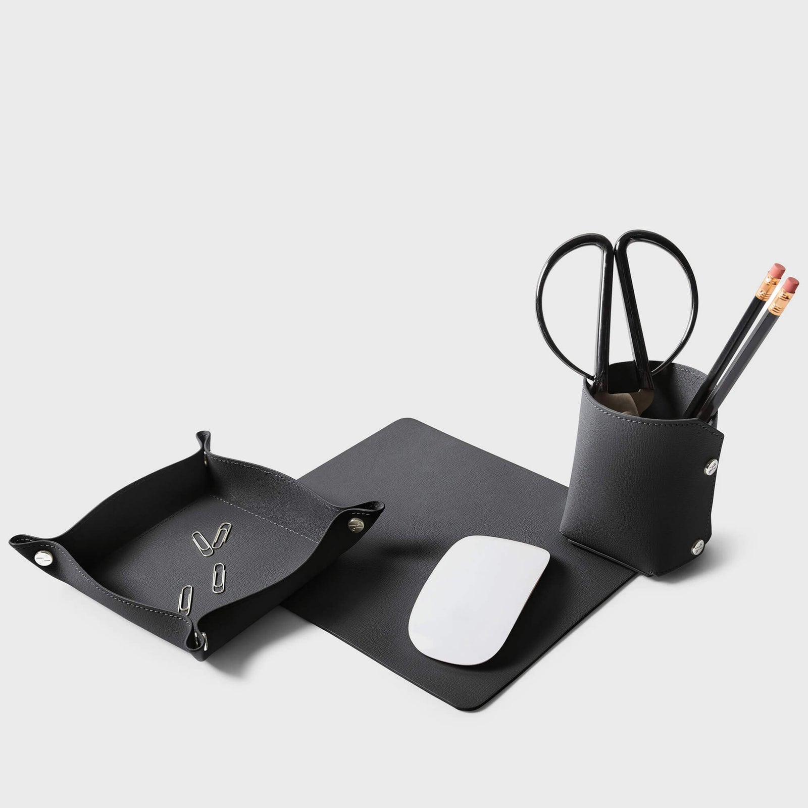 Modern Travel Desk Set by Leatherology featuring a leather mouse pad, valet tray, and pencil cup for portable workspace.