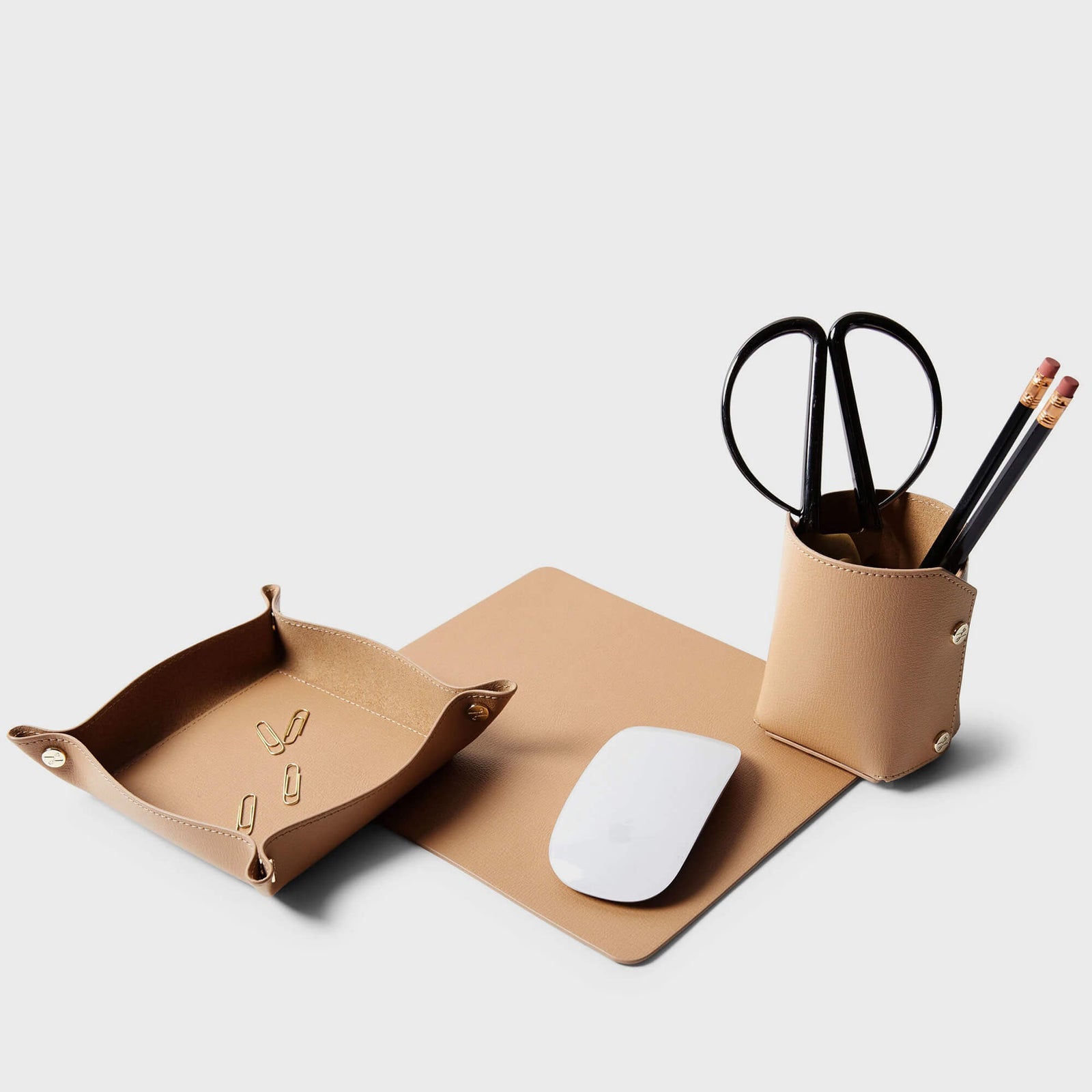 Modern Travel Desk Set by Leatherology featuring a leather mouse pad, valet tray, and pencil cup in tan.