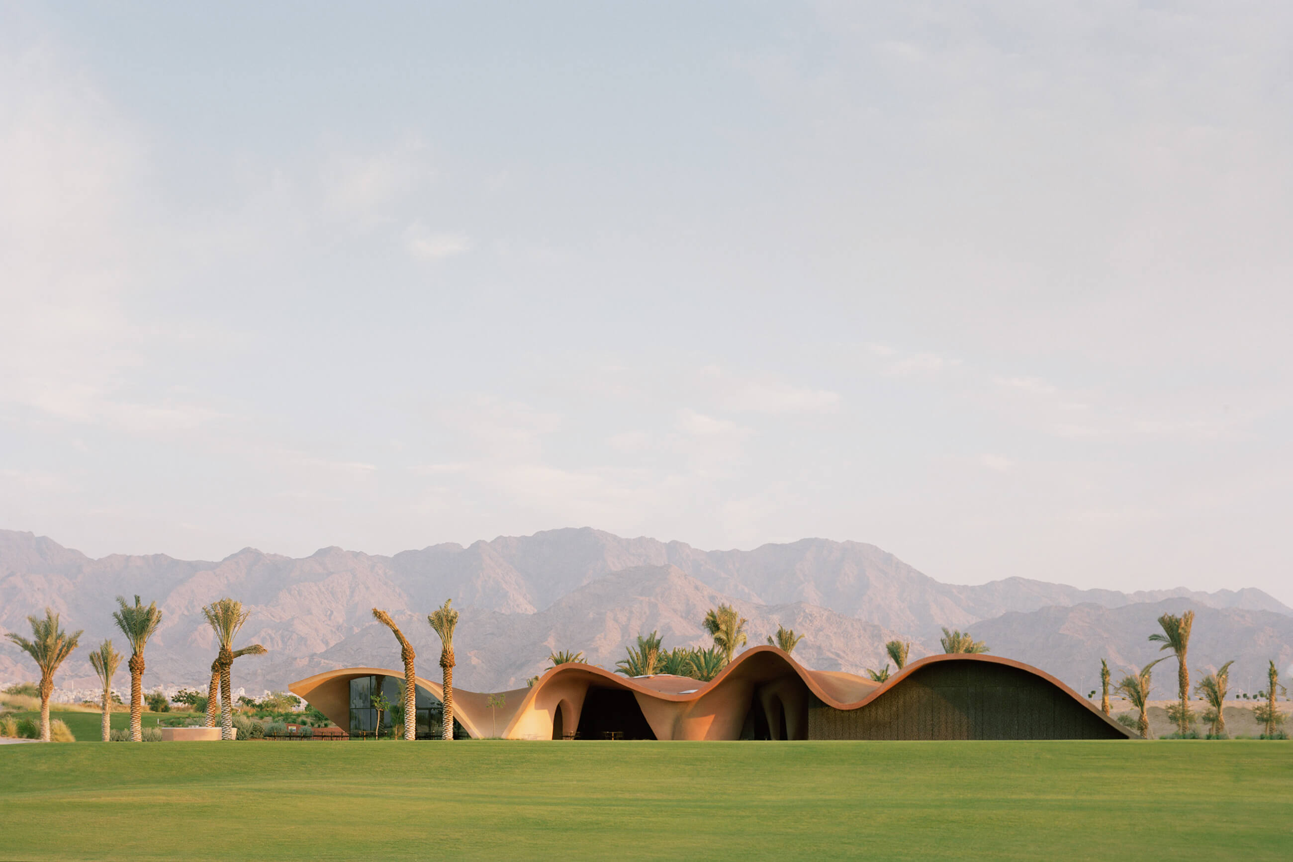 Ayla Golf Clubhouse, inspired by dunes and mountains, the Jordanian desert. Photos by Rory Gardiner.