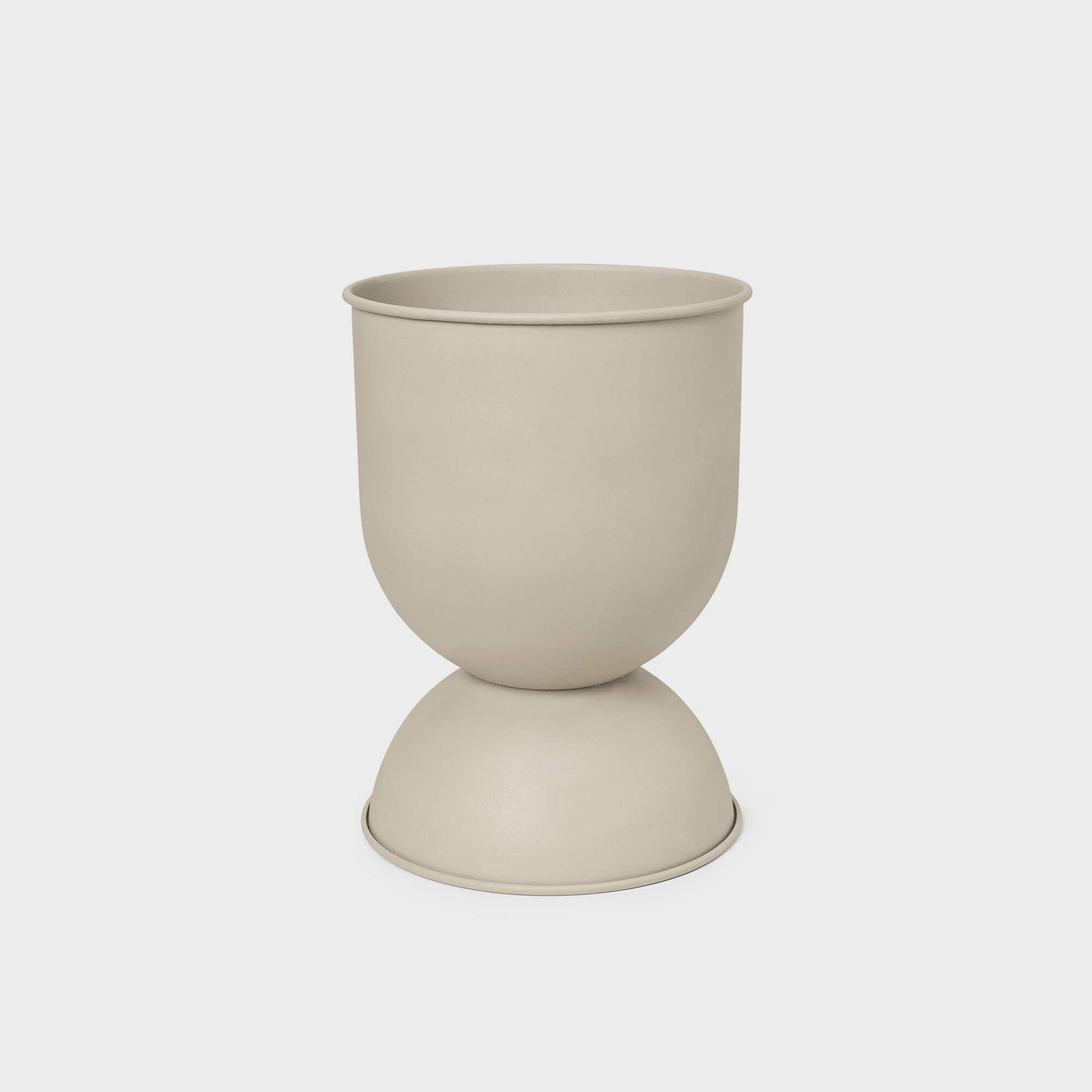Hourglass Planter in matte beige finish, versatile design suitable for indoor or outdoor use.