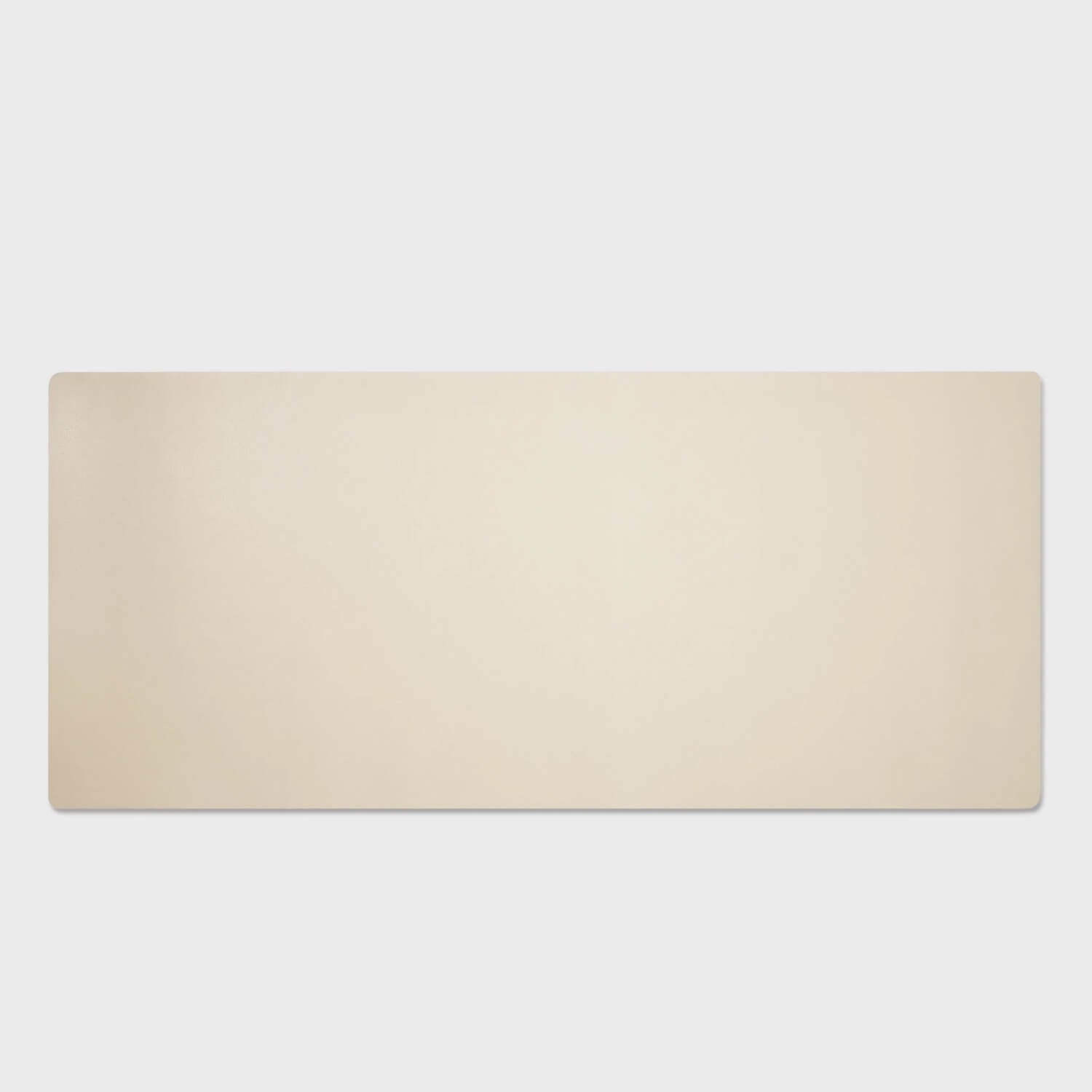 Modern leather desk pad by Leatherology in a sleek, light beige color, perfect for organizing workspace essentials.
