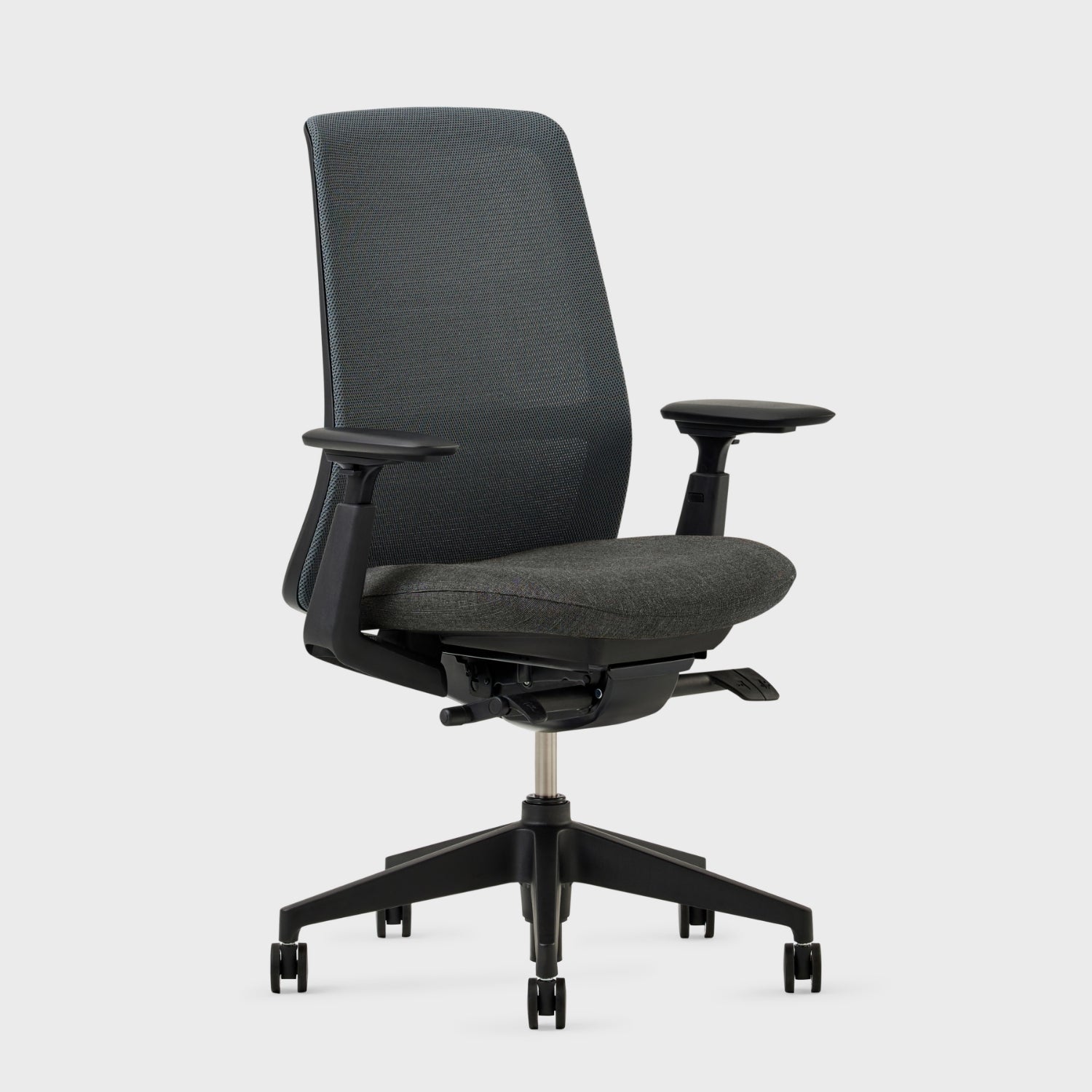 Soji Mesh Office Chair with adjustable armrests and ergonomic design for optimal comfort in an office setting.